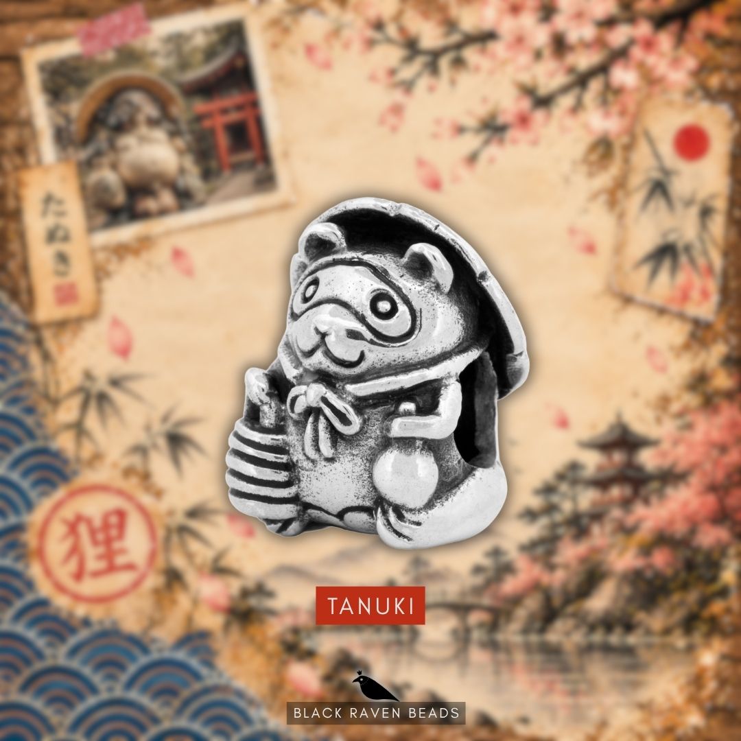 Black Raven Beads Tanuki sterling silver bead displayed against a themed Japanese illustration background