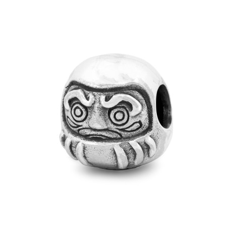 Side view of the Daruma sterling silver bead by Black Raven Beads showing details inspired by the traditional Japanese Daruma doll